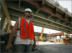 Former Marine sniper Chris Packley works on a highway construction project in Lansing, Ill.